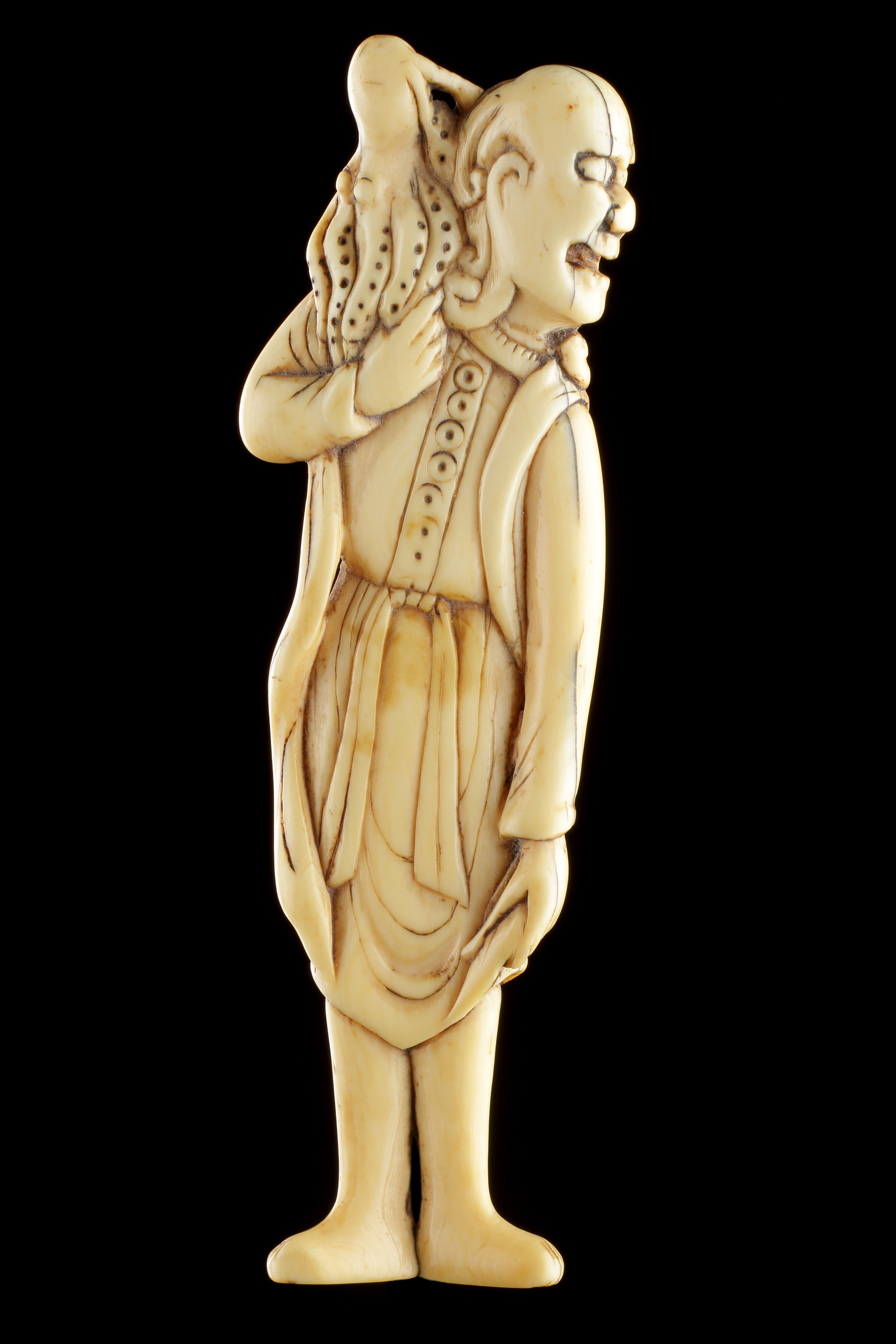 A Fine Japanese Ivory Netsuke of Sennin with an Octopus on his Shoulder  Kyoto School